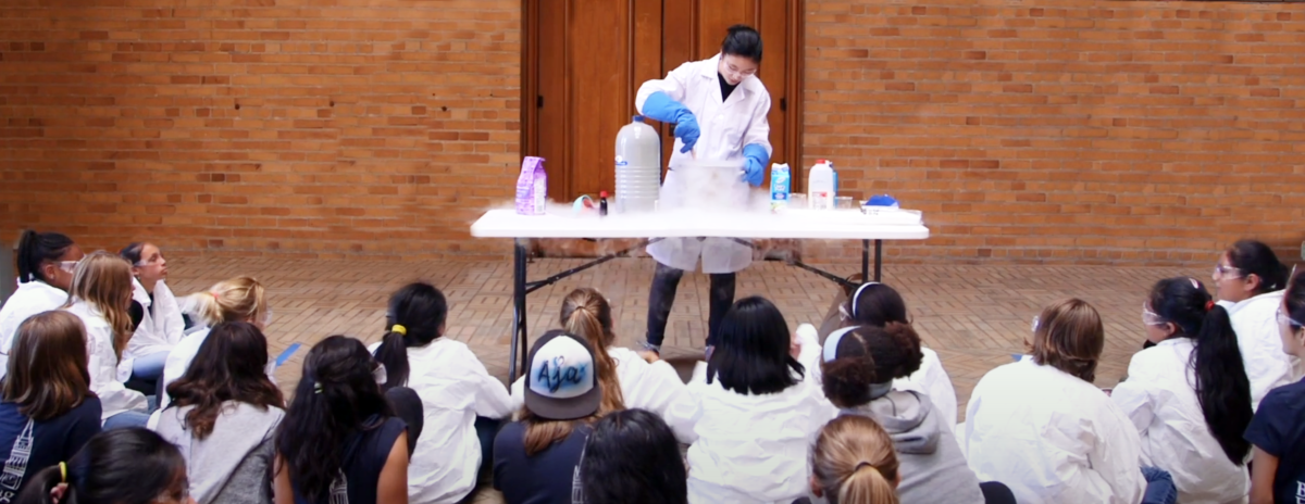 Camp Instructor showing campers how to make ice cream using liquid nitrogen